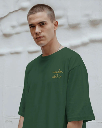 wander_w_map_in_soul_front_male_model_bottle_green