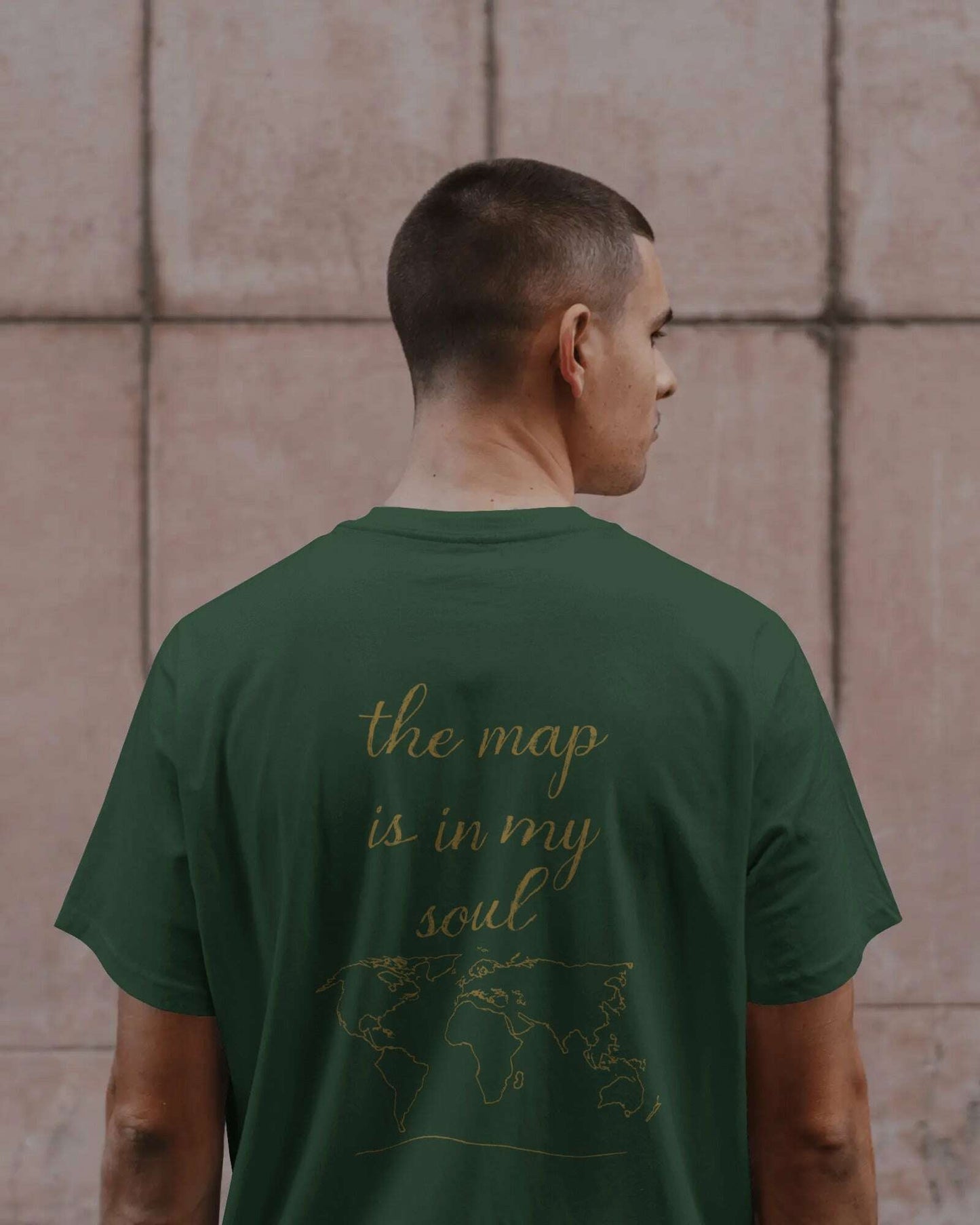 wander_w_map_in_soul_front_model_bottle_green_back_focus_23f15611-8355-402f-b13e-3f86146d6646